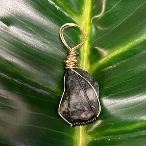 raw green gold & black wire wrapped emerald pendant